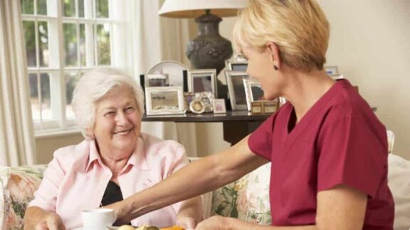 Ohio cost of care: a woman at home and her home care aide.
