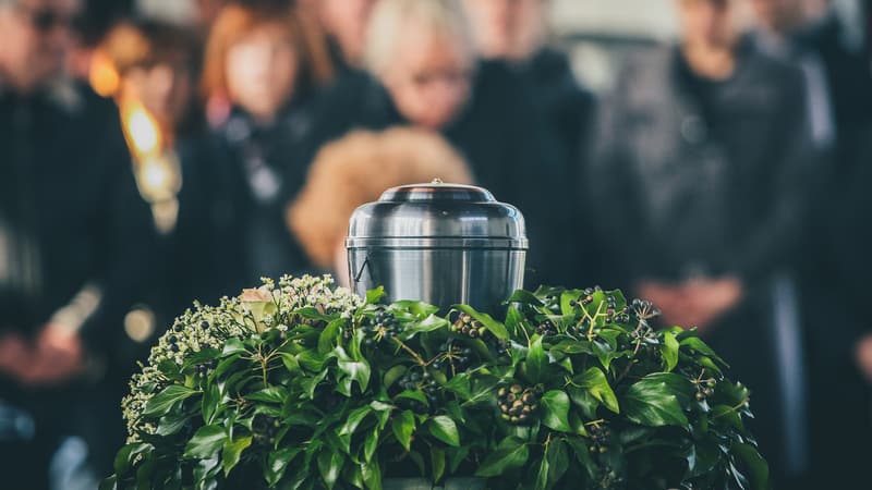 Metal Urn Of Ashes At A Funeral Photo By Anze Furlan Dreamstime. For article, These 10 ways to memorialize a loved one can help you mourn their passing, celebrate their lives, and extend their memory.