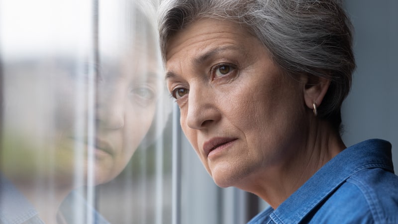 puzzled woman looking out of a window. photo by Fizkes, Dreamstime. Grandmom is angry and at a loss how to respond to an ungrateful, rude grown grandchild. See what Amy Dickinson advises in “Ask Amy.”