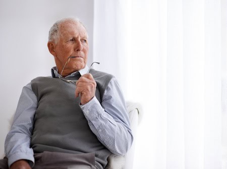 Sad older man feeling lonely, part of the U.S. epidemic of loneliness