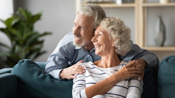 A happy mature couple together at home. By Fizkes. Used with How to Tell Your Adult Children of a New Relationship