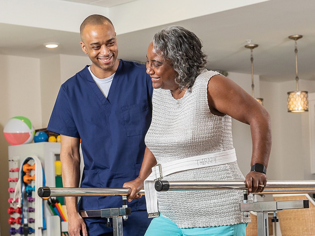 The Pavilion Health Center at Brightmore Senior Lady with Caregiver Rehab Walking
