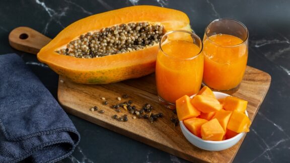 A sliced papaya in juice and chunks to take advantage of the health benefits of papayas.