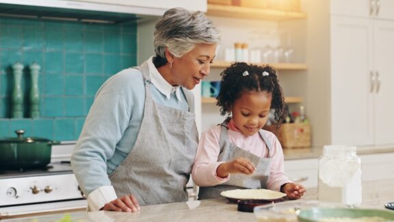 Since monthly visits extend your life, you can plan times when you can help family with chores, such as cooking or babysitting. Image by Yuri Arcurs