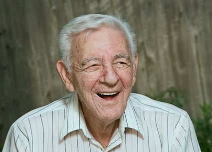 A man laughing looking happy