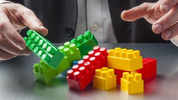 Lego Bricks Benefit People with Dementia, as with this man building with Lego bricks. By Studio Grand Web