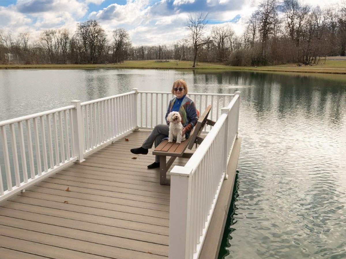 King's Grant Lady with Dog on Dock