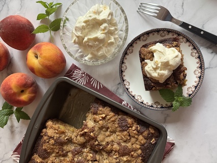 A peach pecan cardamon cake with ice cream