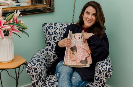 Part-Time Picker in a vintage wing chair with an old McCall's magazine. Image provided by Kelly Gunn.