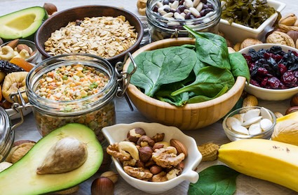 foods that provide the benefits of magnesium: avocado, spinach, banana, etc. Image by Artem Evdokomov