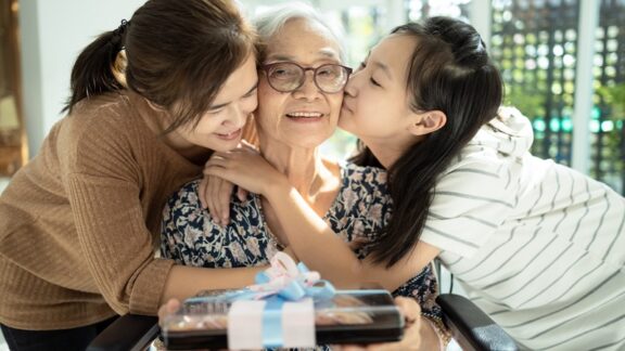 The two women know the best gifts for seniors and the grandmother is happy. Image by Satjawat Boontanataweepol