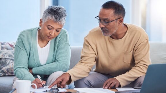 Couple at home dealing with social security changes