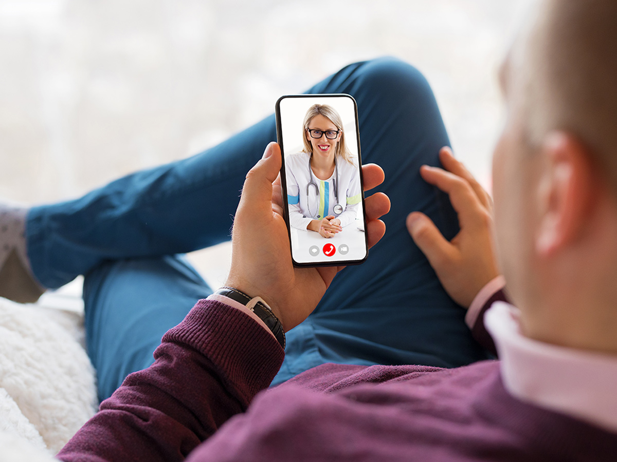 Alma Wellness Group Man with Doctor on Video Call