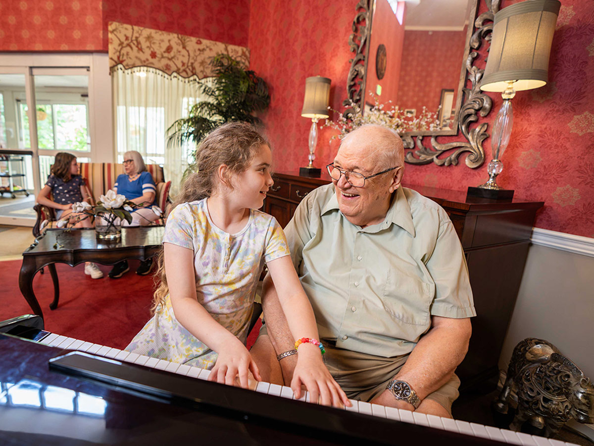 Our Lady of Peace Granddaughter and Grandpa playing piano
