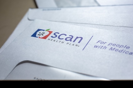 A closeup of a Medicare bill in an envelope.