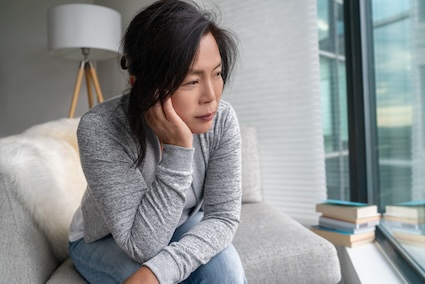Woman looking sad wanting more connection after retirement.