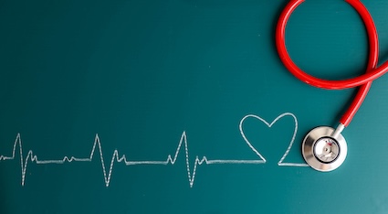 Erratic heartbeat monitor written in chalk representing an abnormal heartbeat.