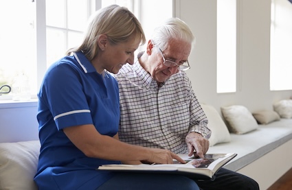 is memory care tax deductible? A professional provides memory care services to a patient. Image by Monkey Business Images