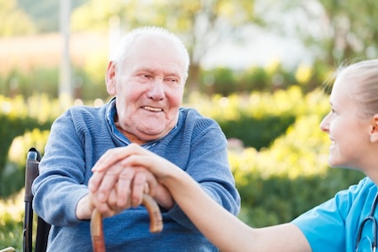 A senior man with a professional at a caregiving facility. Image by Barabas. Some caregiver criticism stems from outsiders judging for a person being put into a community for their care.