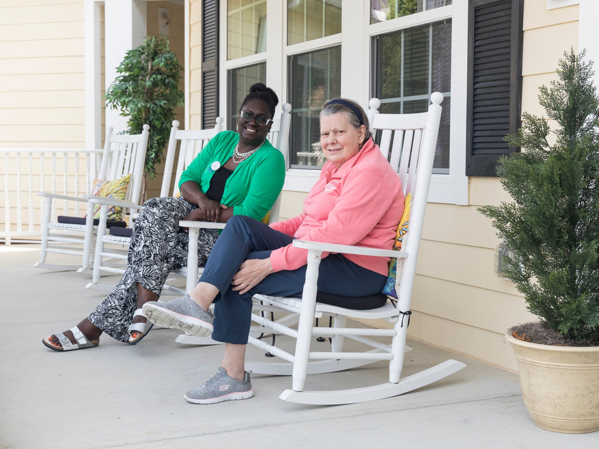 Cadence Garner Friends Sitting in Rocking Chairs