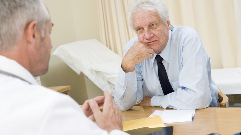 Man talking to doctor about how Medicare prior authorization expands