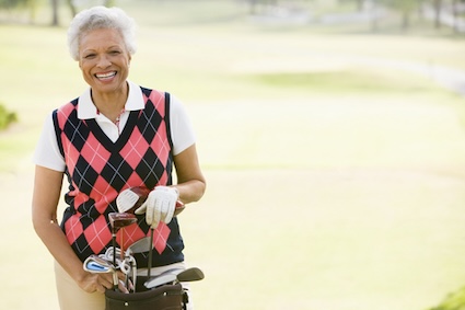 Woman golfing