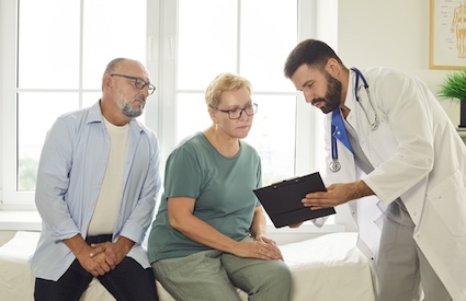 Doctor helping patients in documenting their medical history, asking the same pesky questions. Image by Lacheev.
