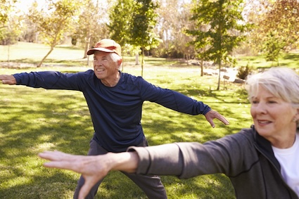 Seniors practicing tai chi for healthy aging. Image by Monkey Business Images