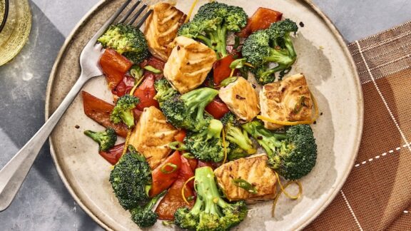 A yummy salmon and broccoli dish ready to eat.