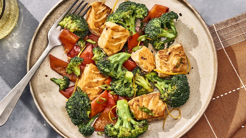 A yummy salmon and broccoli dish ready to eat.