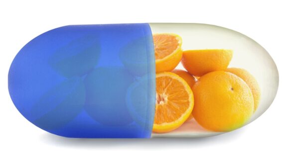A pill with oranges in it, questioning if vitamin c help is real.