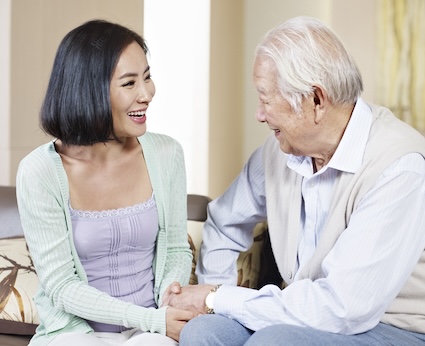 A daughter visits her did in his assisted living facility, knowing the value of visits. By Imtmphoto