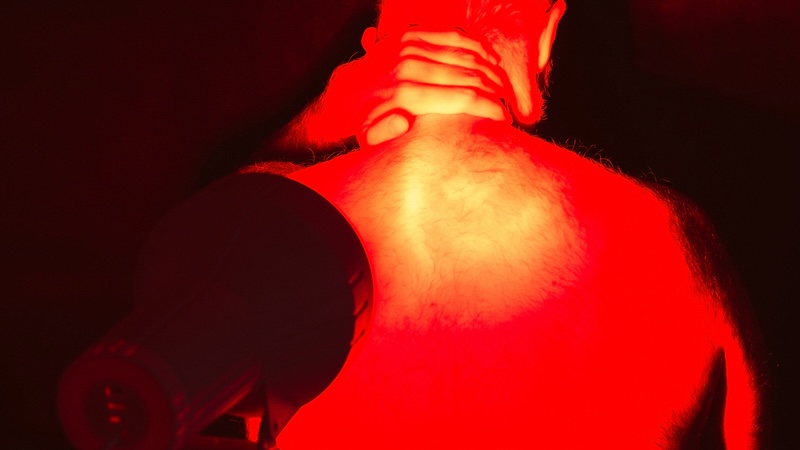 Red light therapy for seniors: a man getting relief from inflammation and arthritis. Image by Jaroslav Moravcik