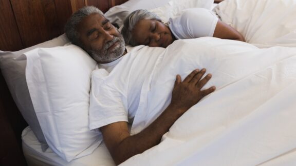 Aging and sleep: this senior couple is sleeping soundly at home in their bed.