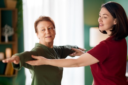 Therapist with patient, practicing integrative medicine for seniors. Image by Konstantin Iuganov