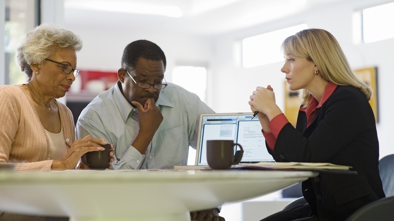 A couple with an estate planning professional trying to implement fairness in estate planning.