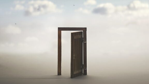 A door and doorframe, detached, leading to clouds: a portal to the imagination. By CristinaConti