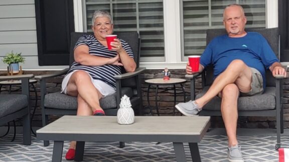 Sylvia and Paul Liebbe on their front porch after the made the decision to downsize.
