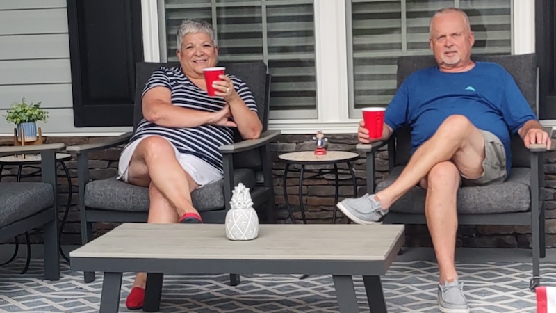 Sylvia and Paul Liebbe on their front porch after the made the decision to downsize.