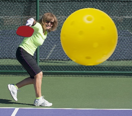 A picleball player risking pickleball injuries