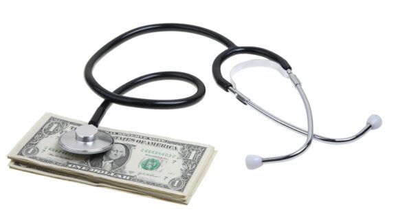 dollars with a stethoscope representing health care tax deductions