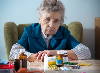 Senior woman with a variety of medications