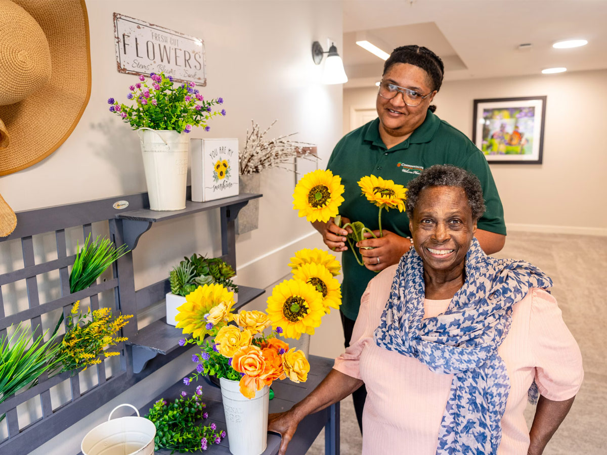 Commonwealth Senior Living at East Paris Lady with Caregiver with Crafts