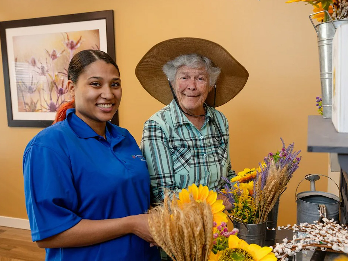 Commonwealth Senior Living at Grand Rapids Lady with Caregiver with Crafts