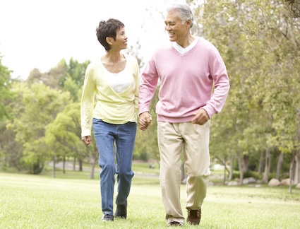 A couple walking, knowing that benefits of fart walking for health. Monkey Business Images