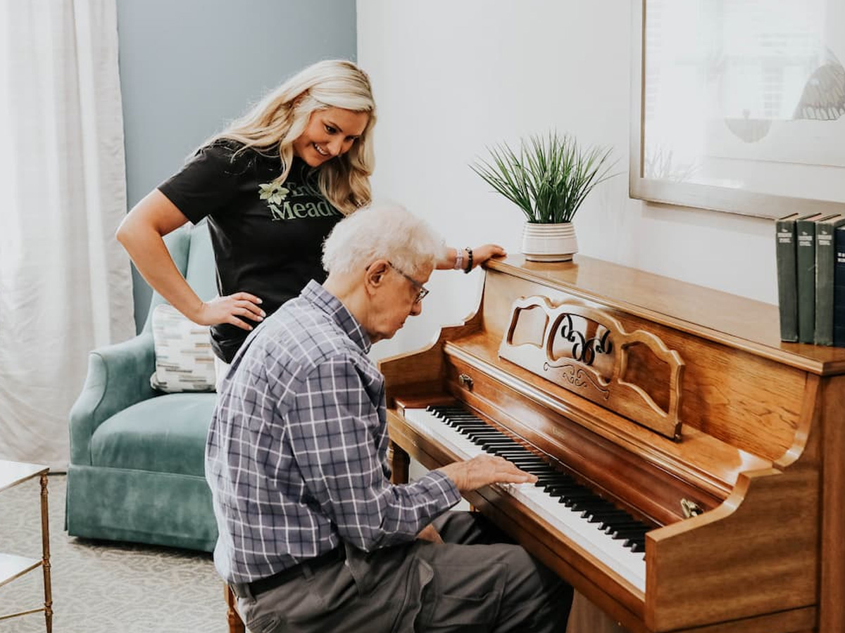 English Meadows Berryville Man Playing Piano