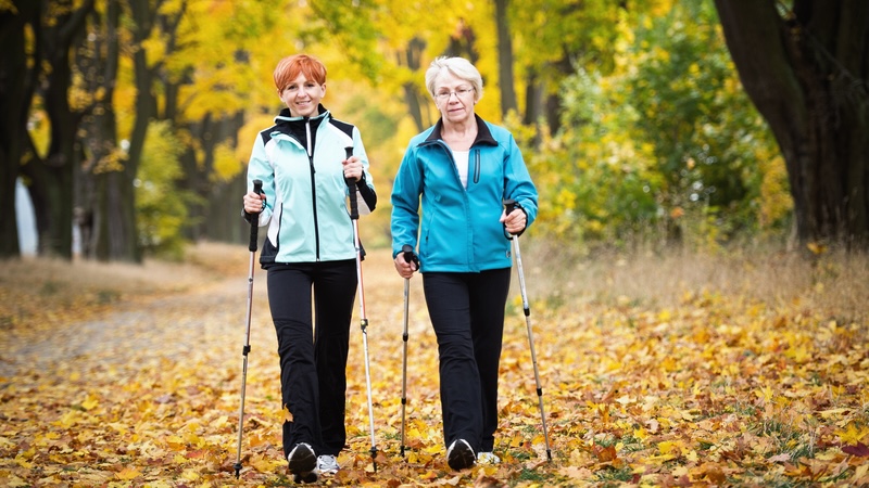 Nordic walking for seniors and others - like these two women - offers multiple benefits, including time outdoors. By Slawomir Kruz..