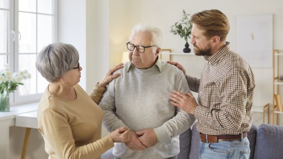 Senior man having a difficult health conversation with his loved ones.