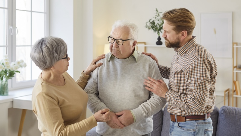 Senior man having a difficult health conversation with his loved ones.