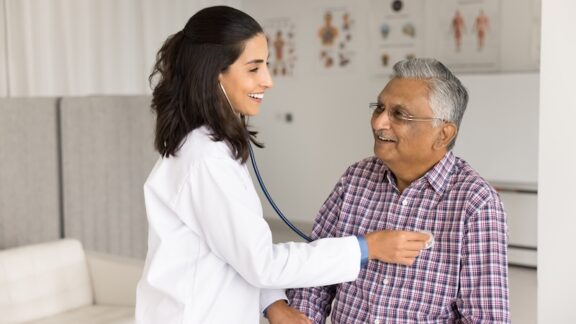 a man getting a doctor check up as part of his wellness checklist for retirees